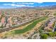 An aerial view of a golf course in a community with homes at 3057 Sunrise Heights Dr, Henderson, NV 89052