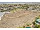 Overhead of a walking path in a desert landscape community with some trees and homes at 3057 Sunrise Heights Dr, Henderson, NV 89052