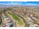 Scenic aerial view of a golf course community featuring lush green fairways and beautiful homes at 3057 Sunrise Heights Dr, Henderson, NV 89052
