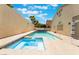 Backyard with a jacuzzi and pool surrounded by a large patio at 3057 Sunrise Heights Dr, Henderson, NV 89052