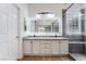 Bathroom featuring a glass shower, double vanity, and granite countertops at 3057 Sunrise Heights Dr, Henderson, NV 89052