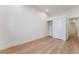 Bedroom with light wood floors, neutral walls, closet with sliding doors, and white trim at 3057 Sunrise Heights Dr, Henderson, NV 89052