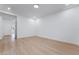 Bright and spacious bedroom with hardwood floors, white walls, and recessed lighting at 3057 Sunrise Heights Dr, Henderson, NV 89052