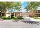 A well-maintained single-story home with a two-car garage, manicured lawn, and tidy desert landscaping at 3057 Sunrise Heights Dr, Henderson, NV 89052