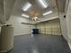 This spacious garage includes epoxy flooring, bright lighting and an automatic door at 3057 Sunrise Heights Dr, Henderson, NV 89052