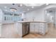 Kitchen island with a stainless steel dishwasher, sink, and light countertop at 3057 Sunrise Heights Dr, Henderson, NV 89052