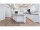 Well-lit kitchen features white cabinets, light countertops, and stainless steel appliances at 3057 Sunrise Heights Dr, Henderson, NV 89052