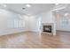 Spacious living room with a fireplace, wood floors, and plenty of natural light at 3057 Sunrise Heights Dr, Henderson, NV 89052