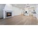 Living room with fireplace, wood floors, recessed lighting, and open to the kitchen at 3057 Sunrise Heights Dr, Henderson, NV 89052