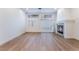 Bright and airy living room with a fireplace and wood floors at 3057 Sunrise Heights Dr, Henderson, NV 89052