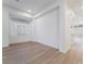 Bright, spacious living room with wood floors, large window, and recessed lights at 3057 Sunrise Heights Dr, Henderson, NV 89052