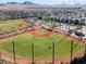 Aerial image of baseball field offering a view of surrounding houses and picturesque mountain scenery at 3062 Echoed Rondel Ln, Henderson, NV 89044
