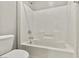 This bathroom has a clean white bathtub and toilet with a shower head fixture at 3062 Echoed Rondel Ln, Henderson, NV 89044