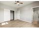 This bedroom boasts an attached closet, a ceiling fan and an adjacent bathroom at 3062 Echoed Rondel Ln, Henderson, NV 89044