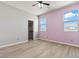 Bedroom with hard wood floors, a walk-in closet and two large windows at 3062 Echoed Rondel Ln, Henderson, NV 89044
