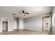 Spacious bedroom with hardwood floors, a ceiling fan, and multiple doorways at 3062 Echoed Rondel Ln, Henderson, NV 89044