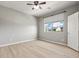 Bright bedroom features wood floors, one large window, and neutral wall color at 3062 Echoed Rondel Ln, Henderson, NV 89044