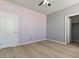 Bedroom with hard wood floors, a closet and two toned walls at 3062 Echoed Rondel Ln, Henderson, NV 89044