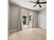 Bright bedroom with sliding glass doors, wood flooring, and neutral walls offering a calming retreat at 3062 Echoed Rondel Ln, Henderson, NV 89044