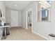 Inviting entryway with a modern design and light hardwood floors, leading into a bright and airy home at 3062 Echoed Rondel Ln, Henderson, NV 89044