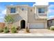Beautiful two-story home showcasing stucco exterior and a well-manicured front yard at 3062 Echoed Rondel Ln, Henderson, NV 89044