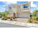 Front view of this two-story home with desert landscaping and a spacious driveway at 3062 Echoed Rondel Ln, Henderson, NV 89044