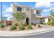 Charming two-story home features a welcoming front entrance, manicured landscaping, and a well-kept lawn at 3062 Echoed Rondel Ln, Henderson, NV 89044