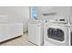 Bright laundry room with modern white appliances and ample counter space at 3062 Echoed Rondel Ln, Henderson, NV 89044