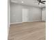 Open living space features wood flooring, high ceilings, and natural light creating a welcoming environment at 3062 Echoed Rondel Ln, Henderson, NV 89044