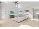 Bright, open living room with high ceilings, large windows, and comfortable sectional seating at 3062 Echoed Rondel Ln, Henderson, NV 89044