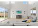 Spacious living area with abundant natural light, a comfortable gray sofa, and modern decor at 3062 Echoed Rondel Ln, Henderson, NV 89044