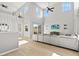 Open-concept living area with soaring ceilings, expansive windows, and stylish decor and comfortable seating at 3062 Echoed Rondel Ln, Henderson, NV 89044