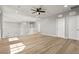Spacious loft area with wood floors, natural light, and access to multiple rooms offering versatile space at 3062 Echoed Rondel Ln, Henderson, NV 89044