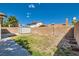Backyard featuring a lawn area, brick perimeter, and a convenient storage shed at 3314 Astoria Dr, Las Vegas, NV 89121