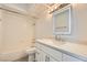Bathroom with vanity, modern fixtures, stone countertop, and a bathtub and shower combination at 3314 Astoria Dr, Las Vegas, NV 89121