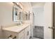 Stylish bathroom with double sinks, modern fixtures, stone countertop, and access to an adjacent bedroom at 3314 Astoria Dr, Las Vegas, NV 89121