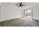 Bright bedroom with a ceiling fan and sliding glass doors leading to a private outdoor space at 3314 Astoria Dr, Las Vegas, NV 89121