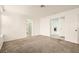 Spacious carpeted bedroom with neutral walls, offering ample natural light at 3314 Astoria Dr, Las Vegas, NV 89121