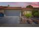 Charming home featuring a tile roof, two-car garage, manicured landscaping, and a brick-lined walkway to the front door at 3314 Astoria Dr, Las Vegas, NV 89121