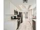 This kitchen features white cabinets, stainless steel appliances, stone countertops, and marble floors at 3314 Astoria Dr, Las Vegas, NV 89121