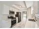 Charming kitchen with stainless appliances, white cabinets, stone countertops, and marble floors at 3314 Astoria Dr, Las Vegas, NV 89121
