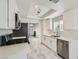 Updated kitchen featuring white cabinets, stainless steel appliances, stone countertops, and marble floors at 3314 Astoria Dr, Las Vegas, NV 89121