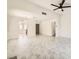 Bright living room featuring marble-like tile flooring, fireplace, and open layout at 3314 Astoria Dr, Las Vegas, NV 89121