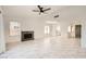 Bright living room featuring marble-like tile flooring, fireplace, and large windows at 3314 Astoria Dr, Las Vegas, NV 89121