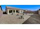 Extensive desert landscaping in backyard offering low maintenance living with a covered patio, perfect for relaxation and entertaining at 3335 American Mustang Ct, Las Vegas, NV 89122