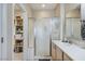 Bright bathroom featuring a sliding glass shower and a walk-in closet at 3335 American Mustang Ct, Las Vegas, NV 89122