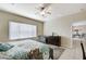 Relaxing bedroom featuring a soft-colored bed and a sitting area at 3335 American Mustang Ct, Las Vegas, NV 89122