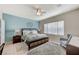 A primary bedroom with a ceiling fan, ensuite bathroom and plenty of natural light at 3335 American Mustang Ct, Las Vegas, NV 89122