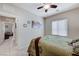 Inviting bedroom features a ceiling fan, neutral walls, and a window with bright natural light at 3335 American Mustang Ct, Las Vegas, NV 89122