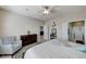 Relaxing bedroom featuring a soft-colored bed and a sitting area at 3335 American Mustang Ct, Las Vegas, NV 89122